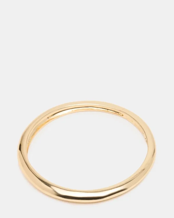 Cienka bransoletka typu bangle w kolorze złotym